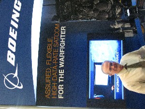 Bob White, RMC exhibit committee member at the Boeing-sponsored exhibit, networks with industry and military members at the January event.